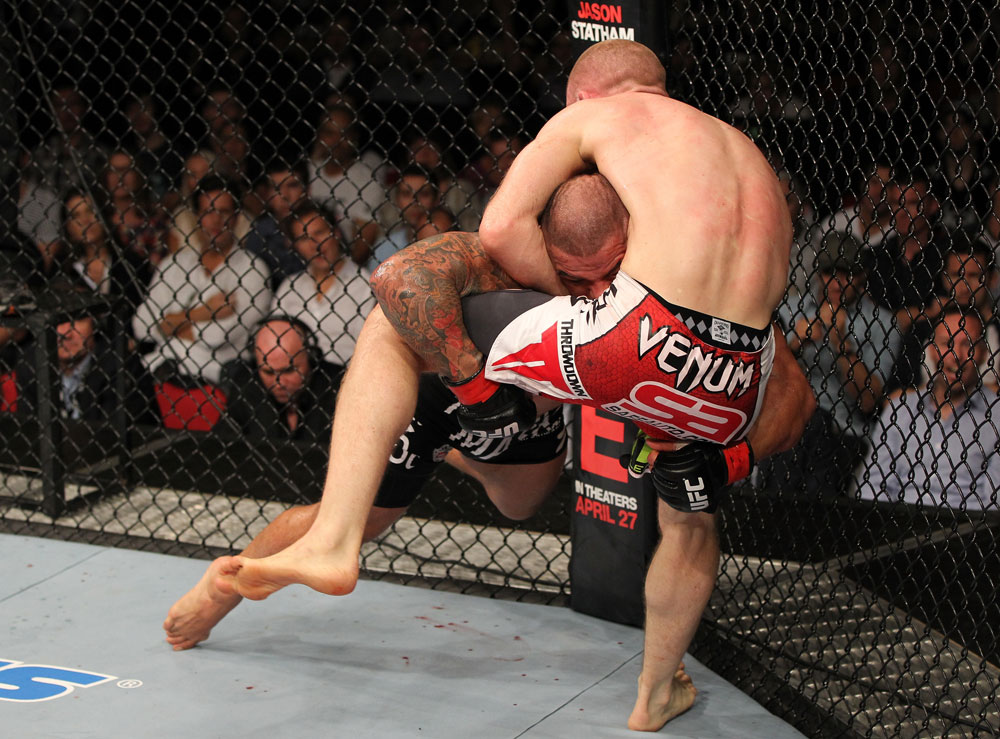 SYDNEY, AUSTRALIA - MARCH 03: (R-L) Martin Kampmann secures a guillotine choke submission to defeat Thiago Alves in a welterweight bout during the UFC on FX event at Allphones Arena on March 3, 2012 in Sydney, Australia. (Photo by Josh Hedges/Zuffa LLC/Zuffa LLC via Getty Images) *** Local Caption *** Thiago Alves; Martin Kampmann