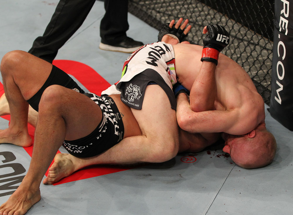 SYDNEY, AUSTRALIA - MARCH 03: (R-L) Martin Kampmann secures a guillotine choke submission to defeat Thiago Alves in a welterweight bout during the UFC on FX event at Allphones Arena on March 3, 2012 in Sydney, Australia. (Photo by Josh Hedges/Zuffa LLC/Zuffa LLC via Getty Images) *** Local Caption *** Thiago Alves; Martin Kampmann