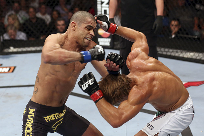 CALGARY, CANADA - JULY 21: (L-R) Renan Barao throws a punch at Urijah Faber during their UFC interim bantamweight championship bout at UFC 149 inside the Scotiabank Saddledome on July 21, 2012 in Calgary, Alberta, Canada.  (Photo by Nick Laham/Zuffa LLC/Zuffa LLC via Getty Images)