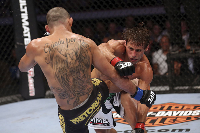 CALGARY, CANADA - JULY 21: (R-L)  Urijah Faber throws a punch at Renan Barao during their UFC interim bantamweight championship bout at UFC 149 inside the Scotiabank Saddledome on July 21, 2012 in Calgary, Alberta, Canada.  (Photo by Nick Laham/Zuffa LLC/Zuffa LLC via Getty Images)