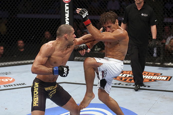 CALGARY, CANADA - JULY 21: (L-R) Renan Barao lands a punch to Urijah Faber during their UFC interim bantamweight championship bout at UFC 149 inside the Scotiabank Saddledome on July 21, 2012 in Calgary, Alberta, Canada.  (Photo by Nick Laham/Zuffa LLC/Zuffa LLC via Getty Images)