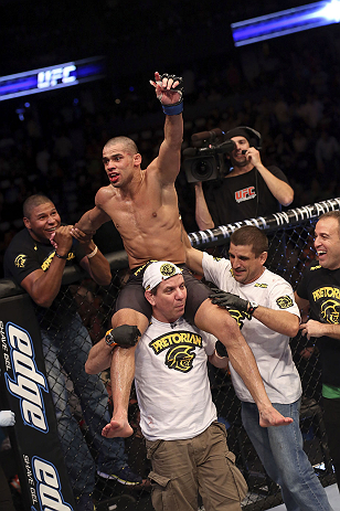 CALGARY, CANADA - JULY 21:  Renan Barao celebrates with his team after his victory over Urijah Faber after their UFC interim bantamweight championship bout at UFC 149 inside the Scotiabank Saddledome on July 21, 2012 in Calgary, Alberta, Canada.  (Photo by Nick Laham/Zuffa LLC/Zuffa LLC via Getty Images)