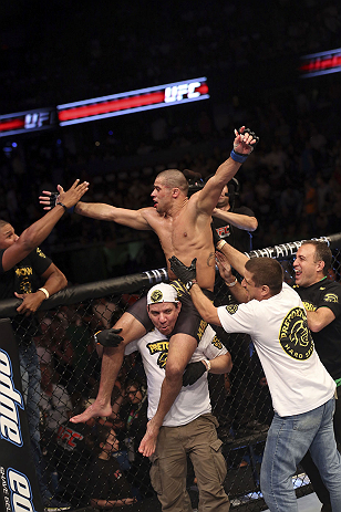 CALGARY, CANADA - JULY 21:  Renan Barao celebrates with his team after his victory over Urijah Faber after their UFC interim bantamweight championship bout at UFC 149 inside the Scotiabank Saddledome on July 21, 2012 in Calgary, Alberta, Canada.  (Photo by Nick Laham/Zuffa LLC/Zuffa LLC via Getty Images)