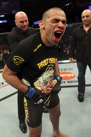 CALGARY, CANADA - JULY 21:  Renan Barao celebrates his victory over Urijah Faber as UFC President Dana White gives him the Championship belt after their UFC interim bantamweight championship bout at UFC 149 inside the Scotiabank Saddledome on July 21, 2012 in Calgary, Alberta, Canada.  (Photo by Nick Laham/Zuffa LLC/Zuffa LLC via Getty Images)