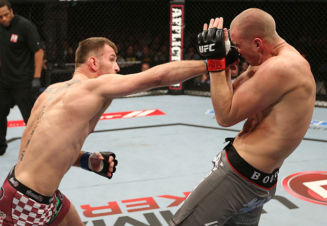 NOTTINGHAM, ENGLAND - SEPTEMBER 29: (L-R) Stipe Miocic punches Strefan Struve during their heavyweight fight at the UFC on Fuel TV event at Capital FM Arena on September 29, 2012 in Nottingham, England. (Photo by Josh Hedges/Zuffa LLC/Zuffa LLC via Getty Images)