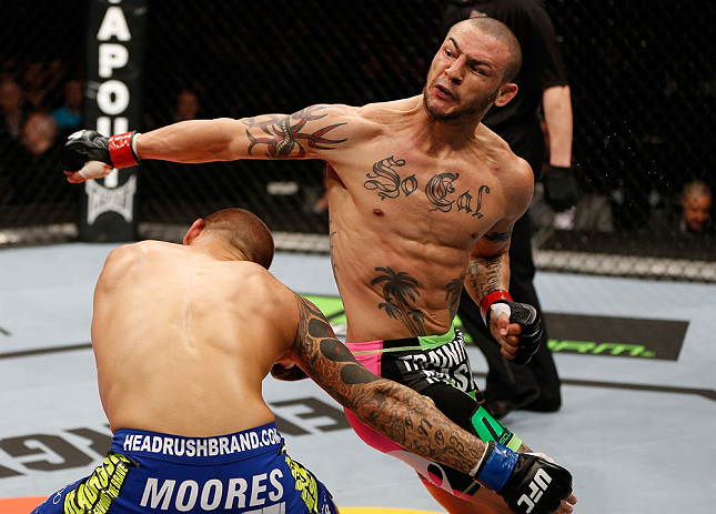 LONDON, ENGLAND - FEBRUARY 16: (R-L) Cub Swanson throws a spinning back fist against Dustin Poirier in their featherweight fight during the UFC on Fuel TV event on February 16, 2013 at Wembley Arena in London, England. (Photo by Josh Hedges/Zuffa LLC/Zuffa LLC via Getty Images)