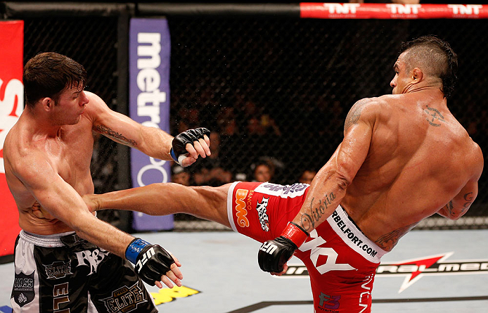 SAO PAULO, BRAZIL - JANUARY 19: (R-L) Vitor Belfort kicks Michael Bisping in their middleweight fight at the UFC on FX event on January 19, 2013 at Ibirapuera Gymnasium in Sao Paulo, Brazil. (Photo by Josh Hedges/Zuffa LLC/Zuffa LLC via Getty Images)