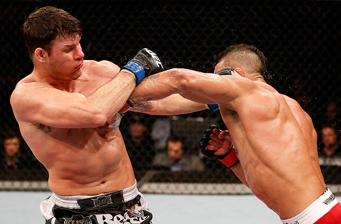 SAO PAULO, BRAZIL - JANUARY 19: (R-L) Vitor Belfort punches Michael Bisping in their middleweight fight at the UFC on FX event on January 19, 2013 at Ibirapuera Gymnasium in Sao Paulo, Brazil. (Photo by Josh Hedges/Zuffa LLC/Zuffa LLC via Getty Images)