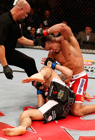 SAO PAULO, BRAZIL - JANUARY 19: Vitor Belfort (top) punches down at Michael Bisping in their middleweight fight at the UFC on FX event on January 19, 2013 at Ibirapuera Gymnasium in Sao Paulo, Brazil. (Photo by Josh Hedges/Zuffa LLC/Zuffa LLC via Getty Images)
