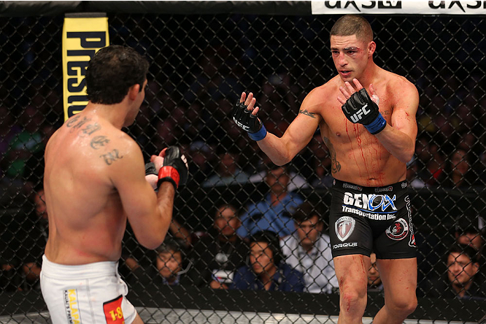 HOUSTON, TEXAS - OCTOBER 19:  (R-L) Diego Sanchez taunts Gilbert Melendez in their UFC lightweight bout at the Toyota Center on October 19, 2013 in Houston, Texas. (Photo by Nick Laham/Zuffa LLC/Zuffa LLC via Getty Images)