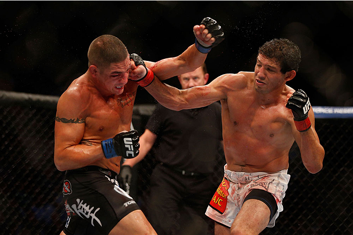 HOUSTON, TEXAS - OCTOBER 19:  (R-L) Gilbert Melendez punches Diego Sanchez in their UFC lightweight bout at the Toyota Center on October 19, 2013 in Houston, Texas. (Photo by Josh Hedges/Zuffa LLC/Zuffa LLC via Getty Images)