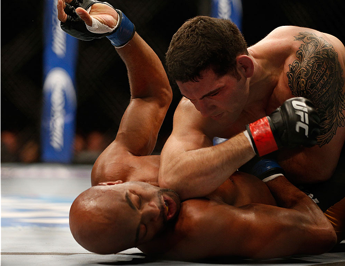 LAS VEGAS, NV - DECEMBER 28:  Chris Weidman (top) elbows Anderson Silva in their UFC middleweight championship bout during the UFC 168 event at the MGM Grand Garden Arena on December 28, 2013 in Las Vegas, Nevada. (Photo by Josh Hedges/Zuffa LLC/Zuffa LLC via Getty Images) *** Local Caption *** Chris Weidman; Anderson Silva