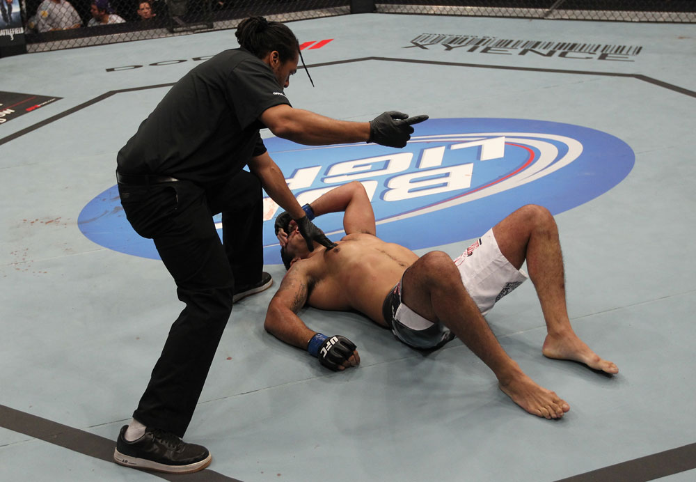 TORONTO, ON - DECEMBER 10:  (L-R) Referee Herb Dean calls for a doctor after Antonio Rodrigo Nogueira suffered a separated shoulder from an arm lock against Frank Mir during the UFC 140 event at Air Canada Centre on December 10, 2011 in Toronto, Ontario, Canada.  (Photo by Nick Laham/Zuffa LLC/Zuffa LLC via Getty Images)