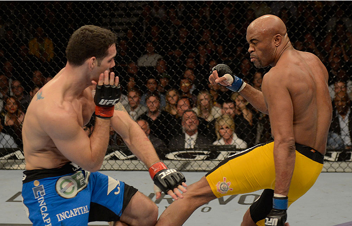 LAS VEGAS, NV - DECEMBER 28:  (R-L) Anderson Silva kicks Chris Weidman in their UFC middleweight championship bout during the UFC 168 event at the MGM Grand Garden Arena on December 28, 2013 in Las Vegas, Nevada. (Photo by Donald Miralle/Zuffa LLC/Zuffa LLC via Getty Images) *** Local Caption *** Chris Weidman; Anderson Silva