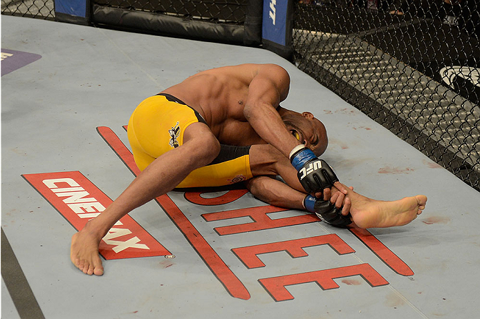 LAS VEGAS, NV - DECEMBER 28:  Anderson Silva holds his leg in pain during the UFC middleweight championship bout during the UFC 168 event at the MGM Grand Garden Arena on December 28, 2013 in Las Vegas, Nevada. (Photo by Donald Miralle/Zuffa LLC/Zuffa LLC via Getty Images) *** Local Caption *** Anderson Silva