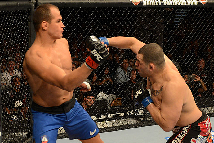 LAS VEGAS, NV - DECEMBER 29:  (R-L) Cain Velasquez punches Junior dos Santos during their heavyweight championship fight at UFC 155 on December 29, 2012 at MGM Grand Garden Arena in Las Vegas, Nevada. (Photo by Donald Miralle/Zuffa LLC/Zuffa LLC via Getty Images) *** Local Caption *** Junior dos Santos; Cain Velasquez