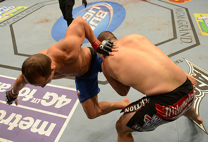 LAS VEGAS, NV - DECEMBER 29:  (R-L) Cain Velasquez takes down Junior dos Santos during their heavyweight championship fight at UFC 155 on December 29, 2012 at MGM Grand Garden Arena in Las Vegas, Nevada. (Photo by Donald Miralle/Zuffa LLC/Zuffa LLC via Getty Images) *** Local Caption *** Junior dos Santos; Cain Velasquez