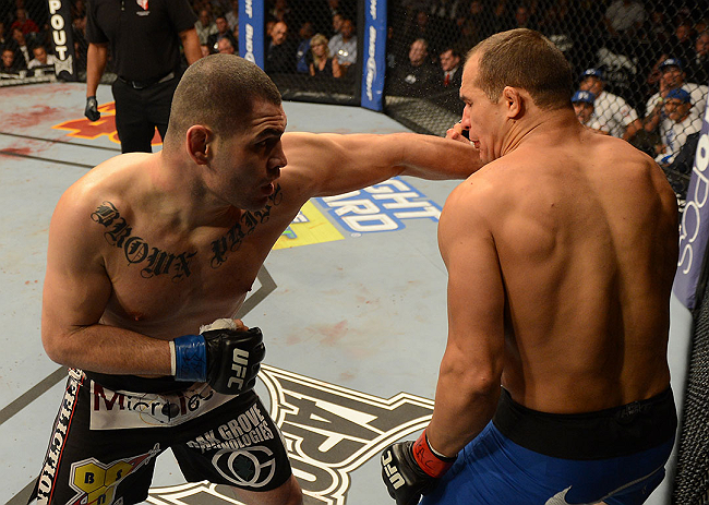 LAS VEGAS, NV - DECEMBER 29:  (L-R) Cain Velasquez punches Junior dos Santos during their heavyweight championship fight at UFC 155 on December 29, 2012 at MGM Grand Garden Arena in Las Vegas, Nevada. (Photo by Donald Miralle/Zuffa LLC/Zuffa LLC via Getty Images) *** Local Caption *** Junior dos Santos; Cain Velasquez