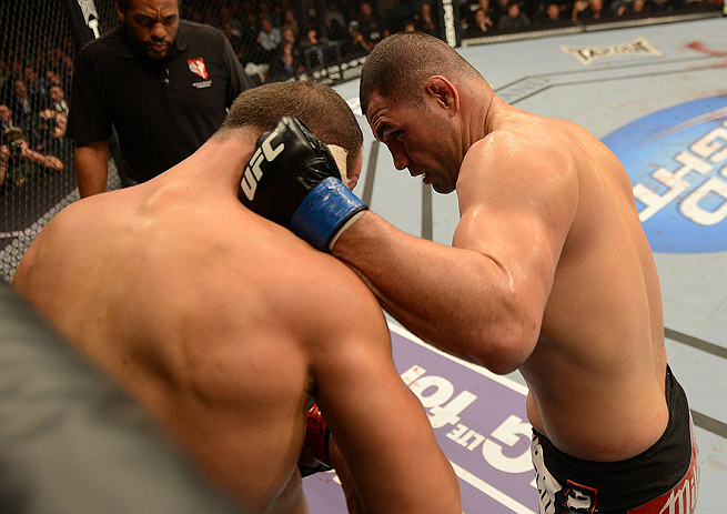 LAS VEGAS, NV - DECEMBER 29:  (R-L) Cain Velasquez punches Junior dos Santos during their heavyweight championship fight at UFC 155 on December 29, 2012 at MGM Grand Garden Arena in Las Vegas, Nevada. (Photo by Donald Miralle/Zuffa LLC/Zuffa LLC via Getty Images) *** Local Caption *** Junior dos Santos; Cain Velasquez
