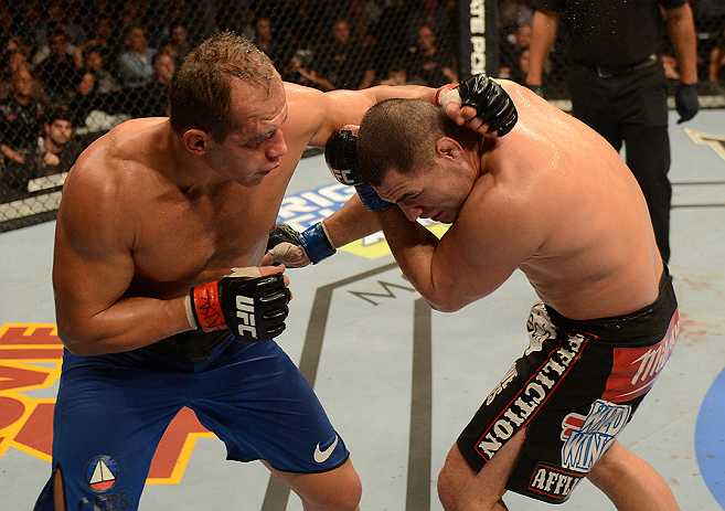 LAS VEGAS, NV - DECEMBER 29:  (L-R) Junior dos Santos punches Cain Velasquez during their heavyweight championship fight at UFC 155 on December 29, 2012 at MGM Grand Garden Arena in Las Vegas, Nevada. (Photo by Donald Miralle/Zuffa LLC/Zuffa LLC via Getty Images) *** Local Caption *** Junior dos Santos; Cain Velasquez