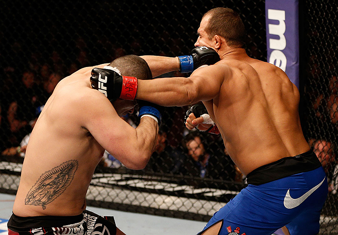 LAS VEGAS, NV - DECEMBER 29:  (L-R) Cain Velasquez punches Junior dos Santos during their heavyweight championship fight at UFC 155 on December 29, 2012 at MGM Grand Garden Arena in Las Vegas, Nevada. (Photo by Josh Hedges/Zuffa LLC/Zuffa LLC via Getty Images) *** Local Caption *** Junior dos Santos; Cain Velasquez