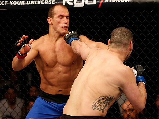 LAS VEGAS, NV - DECEMBER 29:  (R-L) Cain Velasquez punches Junior dos Santos during their heavyweight championship fight at UFC 155 on December 29, 2012 at MGM Grand Garden Arena in Las Vegas, Nevada. (Photo by Josh Hedges/Zuffa LLC/Zuffa LLC via Getty Images) *** Local Caption *** Junior dos Santos; Cain Velasquez
