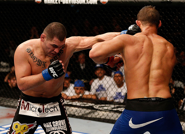 LAS VEGAS, NV - DECEMBER 29:  (L-R) Cain Velasquez punches Junior dos Santos during their heavyweight championship fight at UFC 155 on December 29, 2012 at MGM Grand Garden Arena in Las Vegas, Nevada. (Photo by Josh Hedges/Zuffa LLC/Zuffa LLC via Getty Images) *** Local Caption *** Junior dos Santos; Cain Velasquez