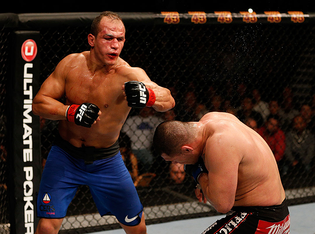 LAS VEGAS, NV - DECEMBER 29:  (L-R) Junior dos Santos punches Cain Velasquez during their heavyweight championship fight at UFC 155 on December 29, 2012 at MGM Grand Garden Arena in Las Vegas, Nevada. (Photo by Josh Hedges/Zuffa LLC/Zuffa LLC via Getty Images) *** Local Caption *** Junior dos Santos; Cain Velasquez