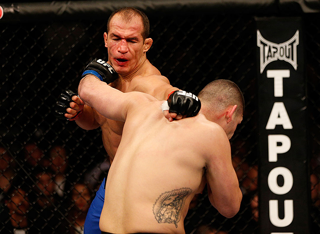 LAS VEGAS, NV - DECEMBER 29:  (R-L) Cain Velasquez punches Junior dos Santos during their heavyweight championship fight at UFC 155 on December 29, 2012 at MGM Grand Garden Arena in Las Vegas, Nevada. (Photo by Josh Hedges/Zuffa LLC/Zuffa LLC via Getty Images) *** Local Caption *** Junior dos Santos; Cain Velasquez