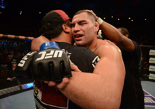 LAS VEGAS, NV - DECEMBER 29:  Cain Velasquez reacts to his victory over Junior dos Santos after their heavyweight championship fight at UFC 155 on December 29, 2012 at MGM Grand Garden Arena in Las Vegas, Nevada. (Photo by Donald Miralle/Zuffa LLC/Zuffa LLC via Getty Images) *** Local Caption *** Junior dos Santos; Cain Velasquez