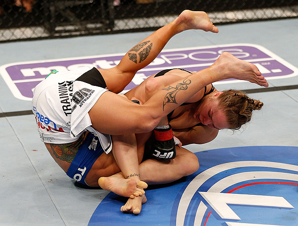ANAHEIM, CA - FEBRUARY 23: Ronda Rousey (right) attempts to submit Liz Carmouche in their women's bantamweight title fight during UFC 157 at Honda Center on February 23, 2013 in Anaheim, California. (Photo by Josh Hedges/Zuffa LLC/Zuffa LLC via Getty Images) *** Local Caption *** Ronda Rousey; Liz Carmouche