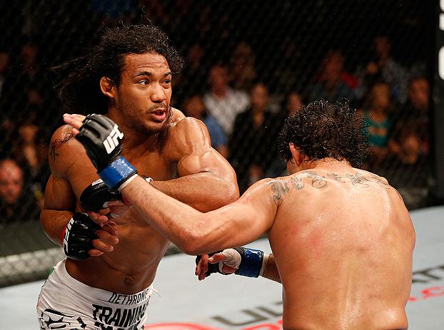 SAN JOSE, CA - APRIL 20:   (L-R) Benson Henderson punches Gilbert Melendez in their lightweight championship bout during the UFC on FOX event during the UFC on FOX event at the HP Pavilion on April 20, 2013 in San Jose, California.  (Photo by Josh Hedges/Zuffa LLC/Zuffa LLC via Getty Images)  *** Local Caption *** Benson Henderson; Gilbert Melendez