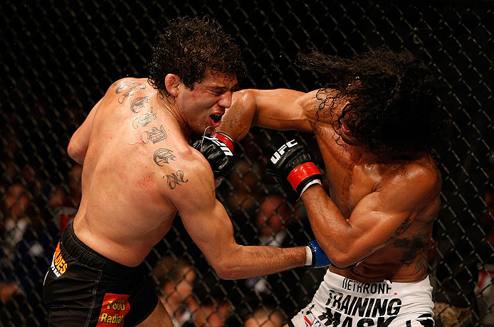 SAN JOSE, CA - APRIL 20:   (R-L) Benson Henderson punches Gilbert Melendez in their lightweight championship bout during the UFC on FOX event during the UFC on FOX event at the HP Pavilion on April 20, 2013 in San Jose, California.  (Photo by Josh Hedges/Zuffa LLC/Zuffa LLC via Getty Images)  *** Local Caption *** Benson Henderson; Gilbert Melendez