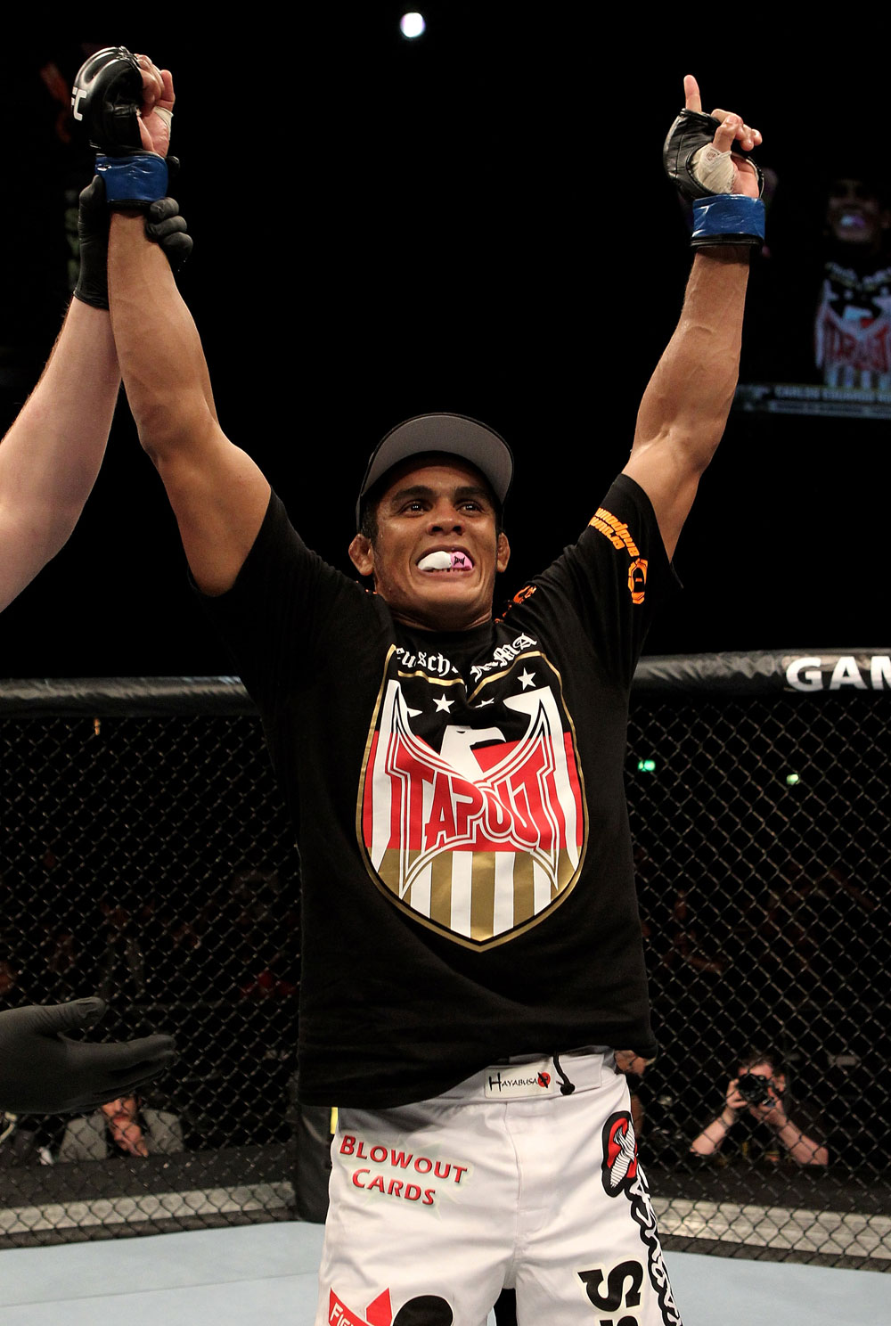 Carlos Eduardo Rocha of Brazil celebrates his victory in the 1st round by tap out over Kris McCray of the USA during their UFC Welterweight bout at the Konig Pilsner Arena on November 13, 2010 in Oberhausen, Germany. (Photo by Josh Hedges/Zuffa LLC/Zuffa LLC via Getty Images)