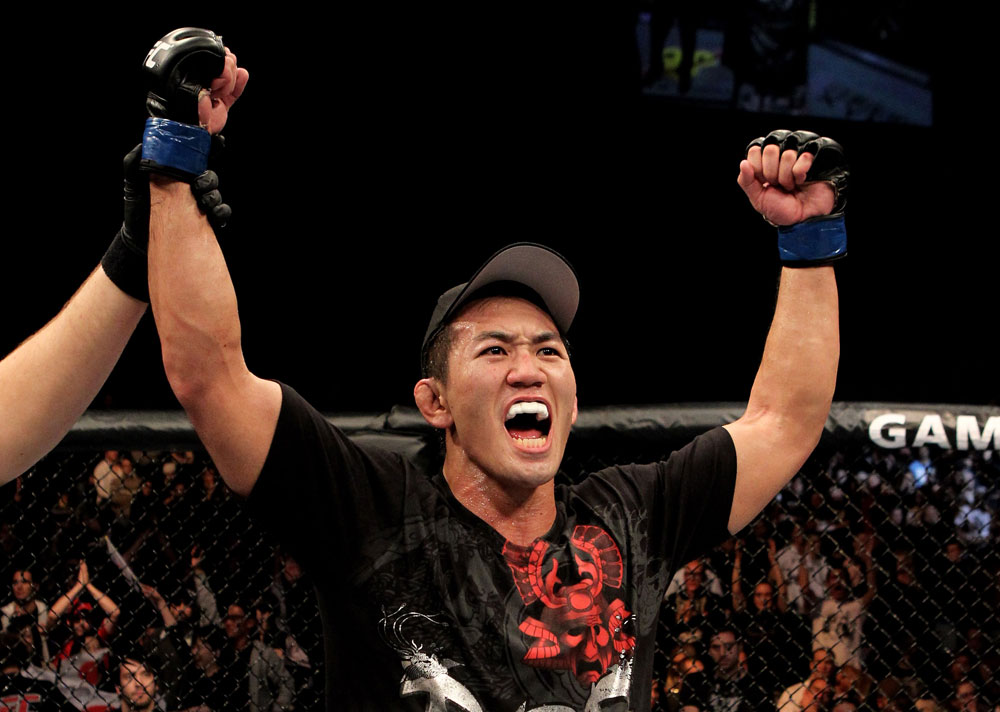 Yushin Okami of Japan celebrates his unanimous points victory over Nate Marquardt of the USA during their UFC Middleweight Championship Eliminator bout at the Konig Pilsner Arena on November 13, 2010 in Oberhausen, Germany. (Photo by Josh Hedges/Zuffa LLC/Zuffa LLC)