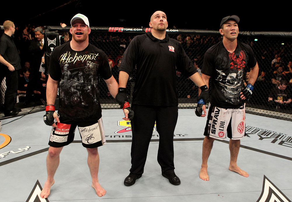 Nate Marquardt of the USA and Yushin Okami (R) of Japan await the decision of the judges during their UFC Middleweight Championship Eliminator bout at the Konig Pilsner Arena on November 13, 2010 in Oberhausen, Germany. (Photo by Josh Hedges/Zuffa LLC/Zuffa LLC)