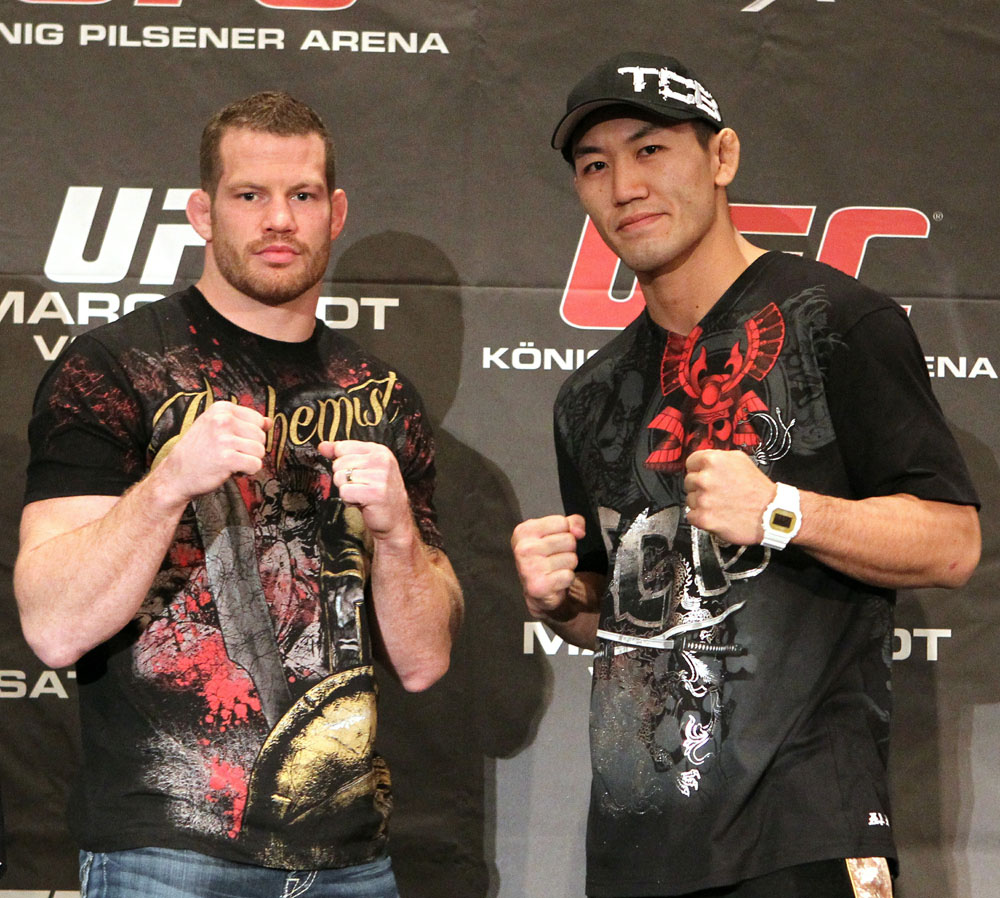 (L-R) Middleweight opponents Nate Marquardt and Yushin Okami face off at the UFC 122 pre-fight press conference at the Hilton Hotel on November 11, 2010 in Dusseldorf, Germany. (Photo by Josh Hedges/Zuffa LLC/Zuffa LLC via Getty Images)