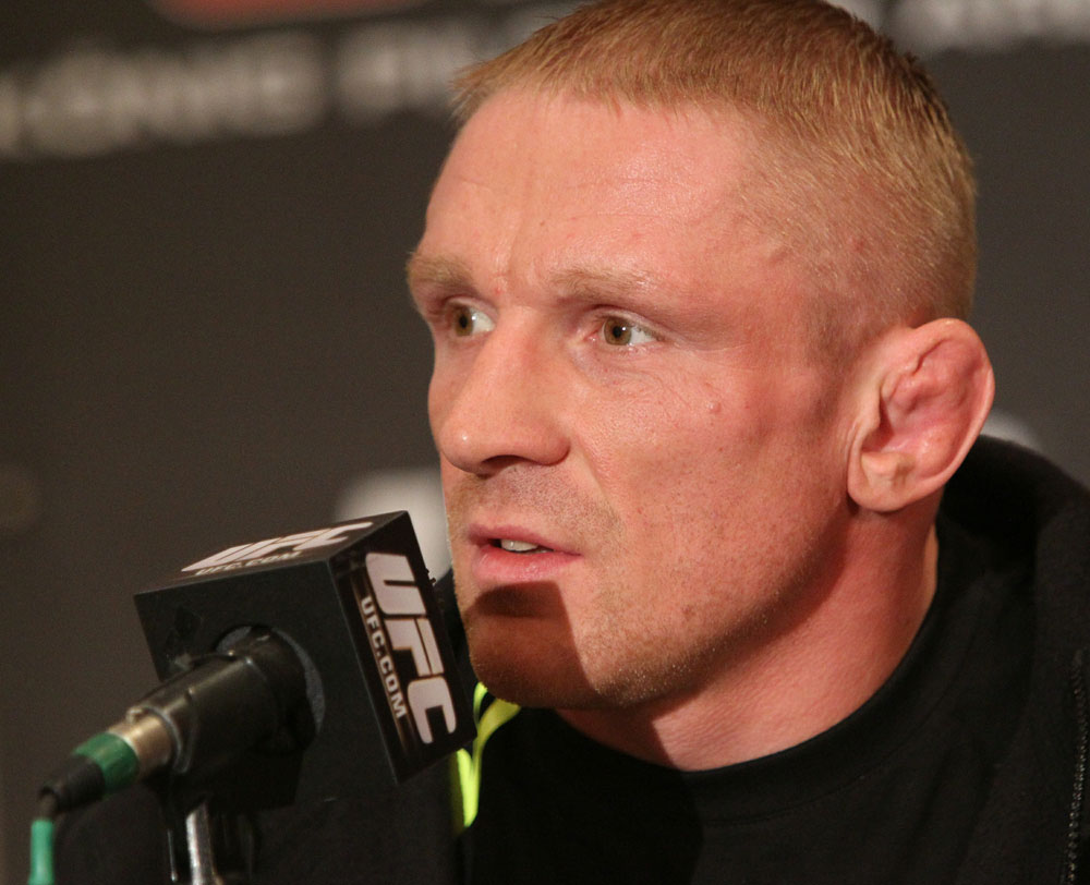 Dennis Siver of Germany speaks at the UFC 122 pre-fight press conference at the Hilton Hotel on November 11, 2010 in Dusseldorf, Germany. (Photo by Josh Hedges/Zuffa LLC/Zuffa LLC via Getty Images)