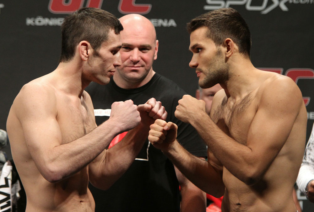 Welterweight opponents Amir Sadollah (L) of United States and Peter Sobotta (R) of Poland face off as UFC President Dana White looks on at the UFC 122 weigh-in at the Koenig Pilsener Arena on November 12, 2010 in Oberhausen, Germany. (Photo by Josh Hedges/Zuffa LLC/Zuffa L