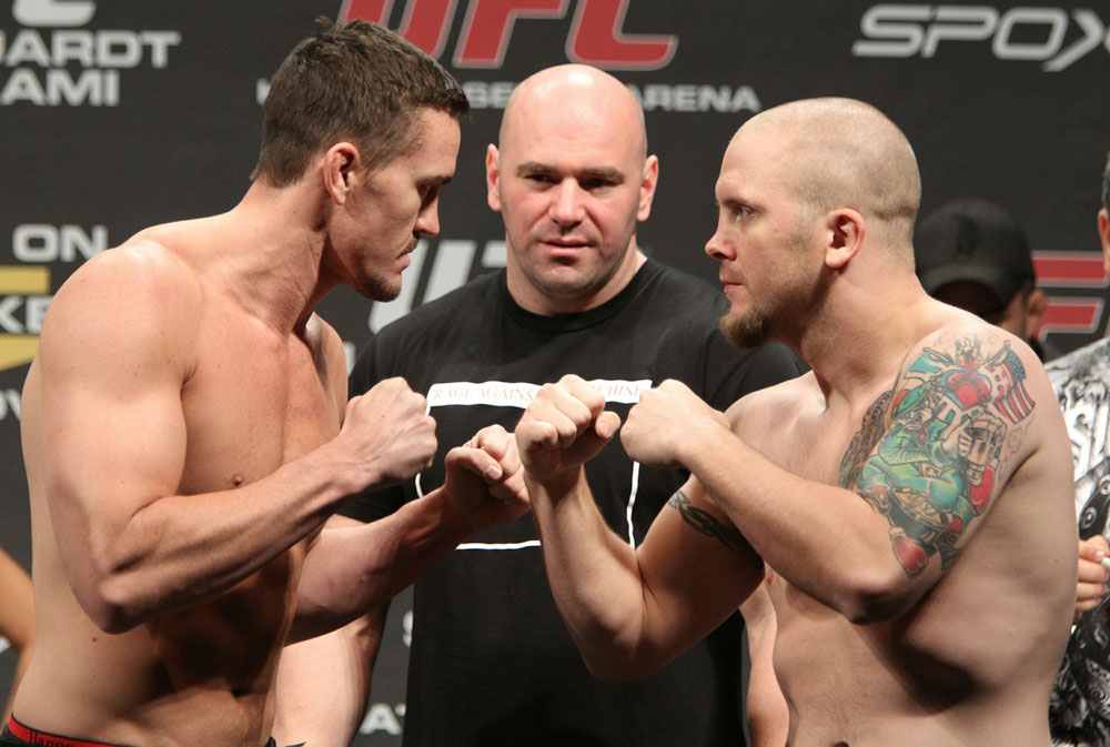 Middleweight opponents Kyle Noke (L) and Rob Kimmons (R) face off as UFC President Dana White looks on at the UFC 122 weigh-in at the Kšnig Pilsener Arena on November 12, 2010 in Oberhausen, Germany. (Photo by Josh Hedges/Zuffa LLC/Zuffa LLC via Getty Images)