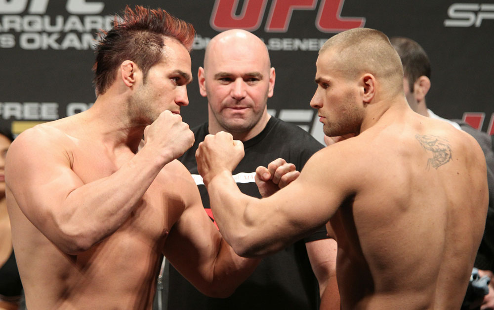 Light Heavyweight opponents Seth Petruzell (L) and Karlos Vemola (R) face off as UFC President Dana White looks on at the UFC 122 weigh-in at the Kšnig Pilsener Arena on November 12, 2010 in Oberhausen, Germany. (Photo by Josh Hedges/Zuffa LLC/Zuffa LLC via Getty Images)