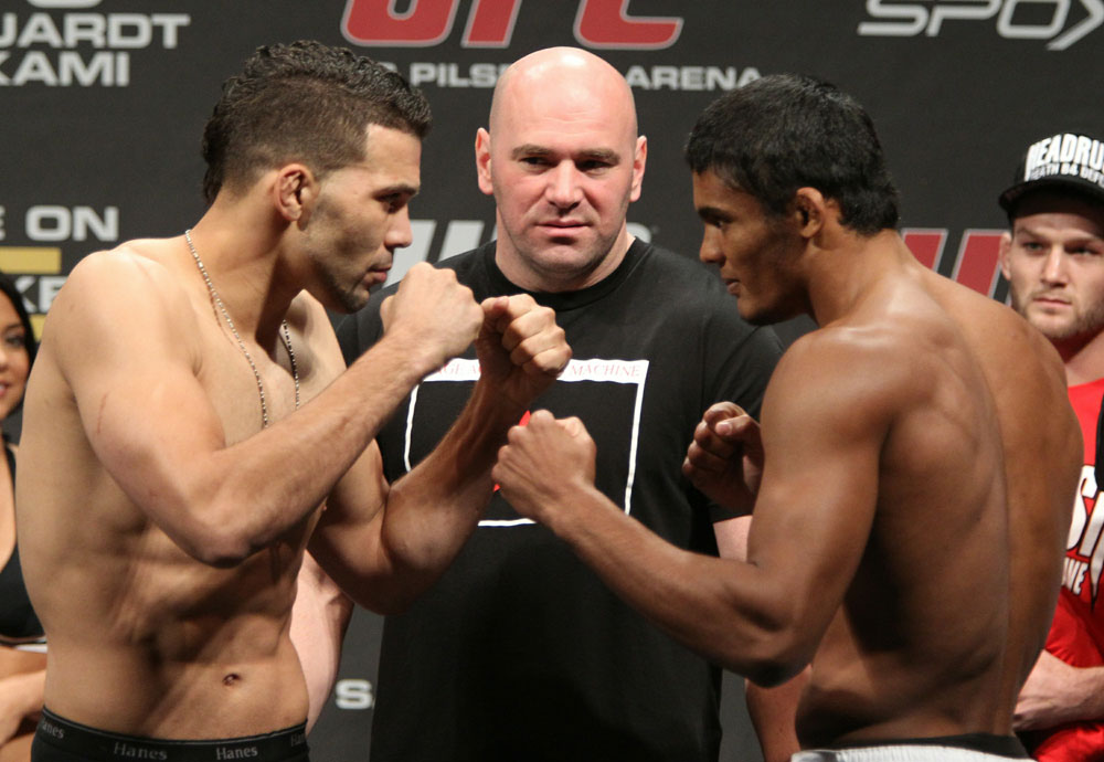 Welterweight opponents Kris McCray (L) and Carlos Eduardo Rocha (R) face off as UFC President Dana White looks on at the UFC 122 weigh-in at the Kšnig Pilsener Arena on November 12, 2010 in Oberhausen, Germany. (Photo by Josh Hedges/Zuffa LLC/Zuffa LLC via Getty Images)