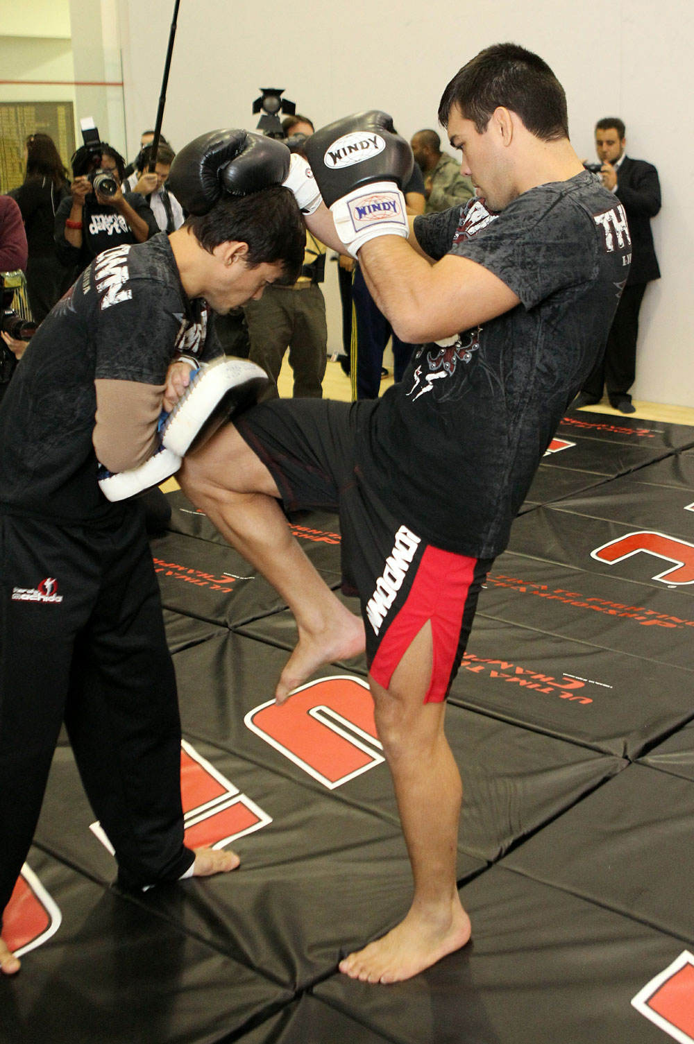 Lyoto Machida (R) works out for the media at the UFC 123 open workouts at the Detroit Athletic Club in Detroit, Michigan on November 18, 2010 (Photo by Josh Hedges/Zuffa LLC/Zuffa LLC via Getty Images)