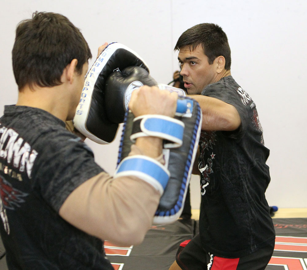 Lyoto Machida (R) works out for the media at the UFC 123 open workouts at the Detroit Athletic Club in Detroit, Michigan on November 18, 2010 (Photo by Josh Hedges/Zuffa LLC/Zuffa LLC via Getty Images)