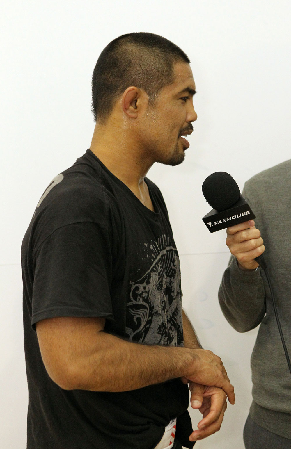 Mark Munoz answers questions from the media at the UFC 123 open workouts at the Detroit Athletic Club in Detroit, Michigan on November 18, 2010 (Photo by Josh Hedges/Zuffa LLC/Zuffa LLC via Getty Images)