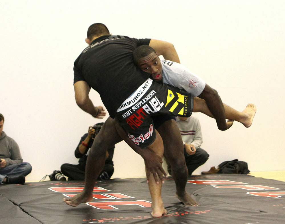 Mark Munoz (L) and Phil Davis (R) work out for the media at the UFC 123 open workouts at the Detroit Athletic Club in Detroit, Michigan on November 18, 2010 (Photo by Josh Hedges/Zuffa LLC/Zuffa LLC via Getty Images)