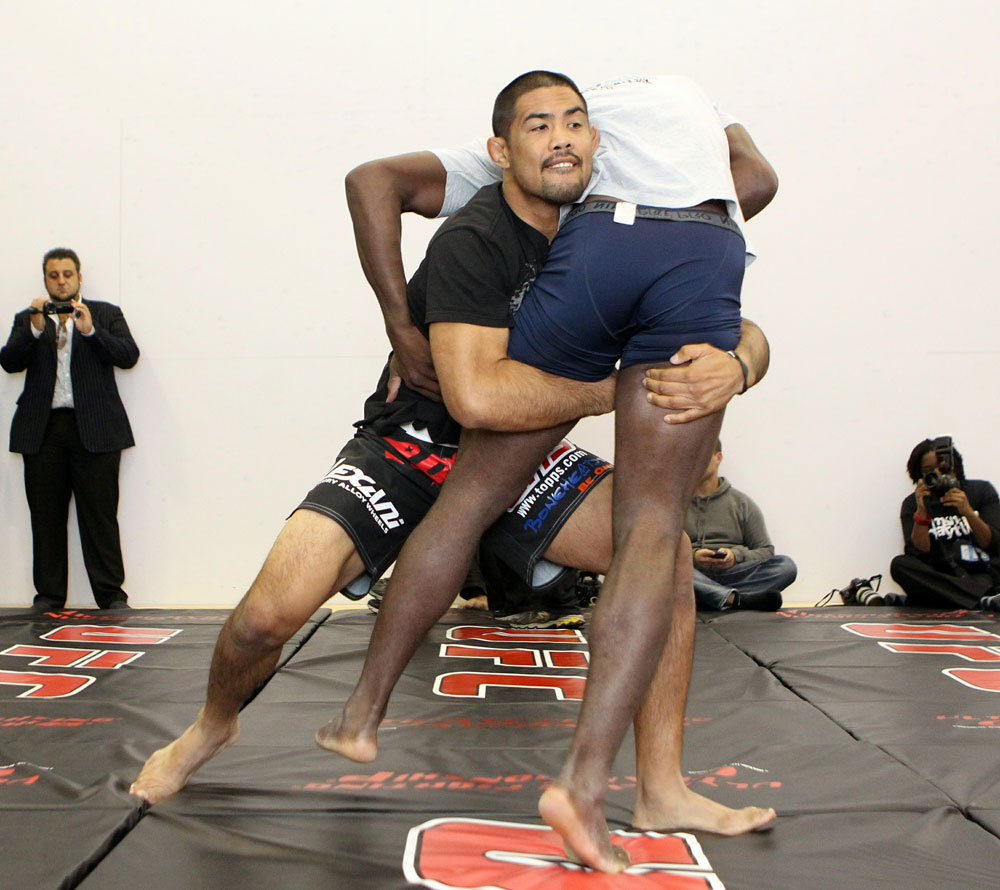 Mark Munoz (L) and Phil Davis (R) work out for the media at the UFC 123 open workouts at the Detroit Athletic Club in Detroit, Michigan on November 18, 2010 (Photo by Josh Hedges/Zuffa LLC/Zuffa LLC via Getty Images)