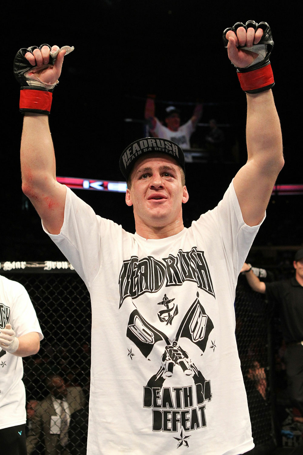 Paul Kelly celebrates his win over TJ O'Brien during UFC 123