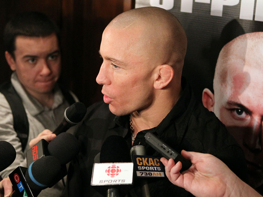 UFC Welterweight Champion Georges St-Pierre answers questions from the media at the UFC 124 open workouts at the Marriott Chateau Champlain in on December 8, 2010 in Montreal, Quebec, Canada.