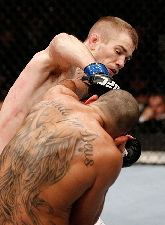 LONDON, ENGLAND - FEBRUARY 16: (L-R) Michael McDonald punches Renan Barao in their interim bantamweight title fight during the UFC on Fuel TV event on February 16, 2013 at Wembley Arena in London, England. (Photo by Josh Hedges/Zuffa LLC/Zuffa LLC via Getty Images)